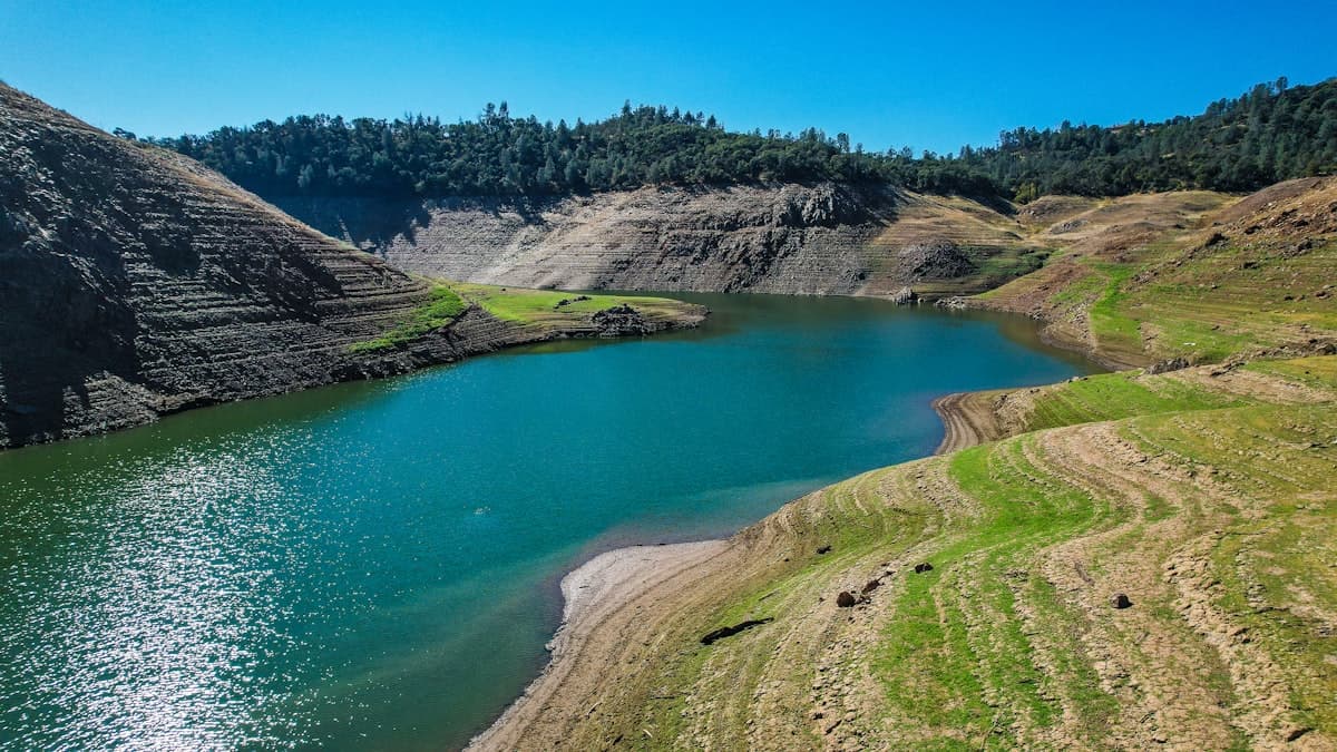A California reservoir with drawdown lines visible along its banks